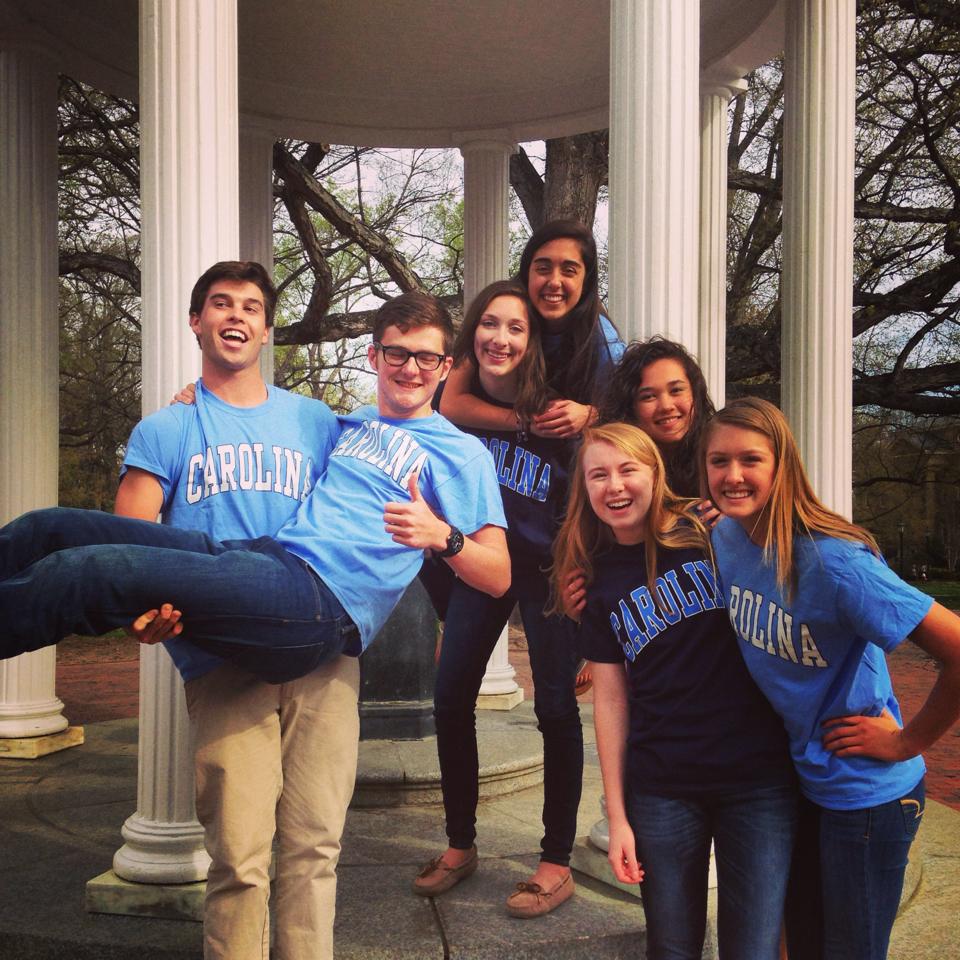 The seven 2014-2015 GGYF Fellows posing by The Old Well