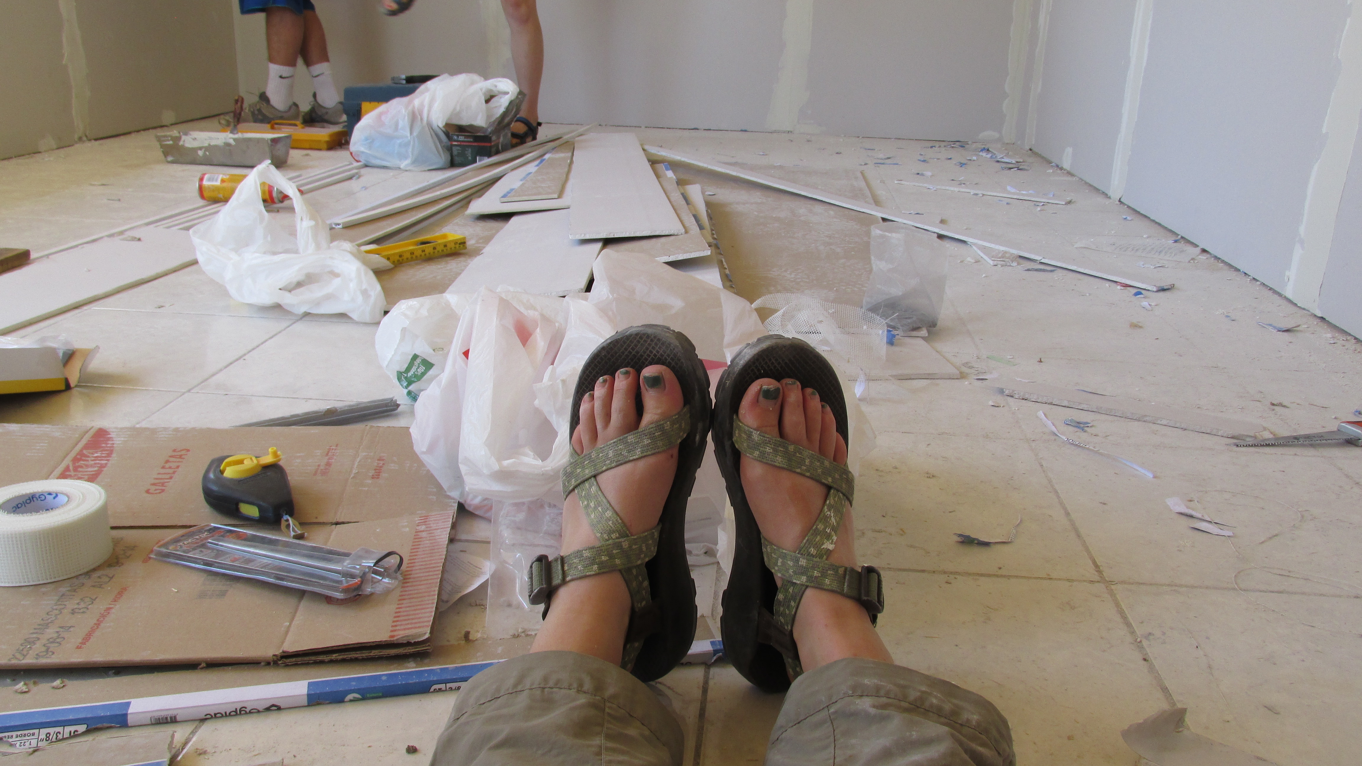 The house, under construction, and my feets with Chacos aka lifesavers of the trip (and probably not good work shoes now that I think of it...)